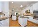 Gourmet kitchen with stainless steel appliances, granite countertops and center island at 3937 Bentley Brook Dr, Raleigh, NC 27612