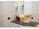 Kitchen nook with granite countertops, beverage center, and ample storage at 3937 Bentley Brook Dr, Raleigh, NC 27612