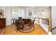 Bright and airy office space with hardwood floors, a desk, and natural light, ideal for productivity and comfort at 3937 Bentley Brook Dr, Raleigh, NC 27612