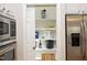 A walk-in pantry features white shelves for storage with a variety of foods and appliances at 3937 Bentley Brook Dr, Raleigh, NC 27612