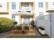 Outdoor dining on a private patio with grill, furniture, and umbrella for shade at 3937 Bentley Brook Dr, Raleigh, NC 27612