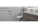 Stylish half bath features modern fixtures, wainscoting, and a marble countertop at 4002 Rothfield Ln, Raleigh, NC 27616