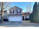 Charming two-story home featuring red shutters and a two-car garage at 4002 Rothfield Ln, Raleigh, NC 27616