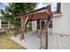 Stylish gazebo with sheer curtains offering an inviting outdoor space for relaxation, featuring a beautifully paved patio at 4002 Rothfield Ln, Raleigh, NC 27616