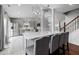 Modern kitchen with a marble countertop bar, stainless steel appliances and gray cabinets at 4002 Rothfield Ln, Raleigh, NC 27616