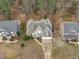 Beautiful aerial view of the home showcasing the roof and the surrounding neighborhood at 401 Acorn Falls Ct, Holly Springs, NC 27540