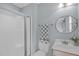 Cozy bathroom features a tile floor, shower and frosted glass door at 401 Acorn Falls Ct, Holly Springs, NC 27540