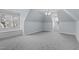 Spacious bedroom offers natural light, soft carpet, and a ceiling fan making it feel open and airy at 401 Acorn Falls Ct, Holly Springs, NC 27540