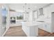Bright, modern kitchen featuring a large island, stainless steel appliances, and natural light at 4724 Cypress Tree Ln, Raleigh, NC 27612