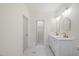 Bathroom featuring a double sink vanity with custom mirrors, lighting and flooring at 512 S 4Th St, Smithfield, NC 27577