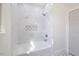 A gorgeous tub/shower is tiled with marble, featuring a built-in shelf for storage at 512 S 4Th St, Smithfield, NC 27577