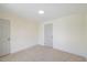 This is an image of a bedroom with neutral paint and carpet and two entry doors at 512 S 4Th St, Smithfield, NC 27577