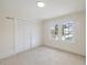 Bright bedroom features double windows, neutral carpet and paint, and large closet at 512 S 4Th St, Smithfield, NC 27577