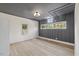 Well-lit bedroom with tray ceiling, wood floors, and plenty of natural light at 512 S 4Th St, Smithfield, NC 27577