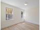 Bright bedroom with hardwood floors and dual windows allowing for natural light at 512 S 4Th St, Smithfield, NC 27577