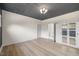 An expansive bedroom with custom ceiling and modern light fixture creates a relaxing atmosphere at 512 S 4Th St, Smithfield, NC 27577