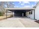 Large carport attached to home, constructed with black support beams and roof at 512 S 4Th St, Smithfield, NC 27577