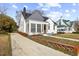 Attractive home featuring a manicured lawn and a long driveway leading up to a brick walkway entrance at 512 S 4Th St, Smithfield, NC 27577