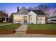 Charming home featuring a brick walkway and a well-maintained lawn in a traditional neighborhood at 512 S 4Th St, Smithfield, NC 27577