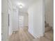 Hallway featuring wood flooring, staircase, and views into other rooms at 512 S 4Th St, Smithfield, NC 27577