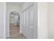 Hallway featuring decorative frosted closet doors and hardwood floors at 512 S 4Th St, Smithfield, NC 27577