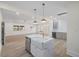 Open-concept kitchen showcasing a marble island with a farmhouse sink, bar, and a wine fridge at 512 S 4Th St, Smithfield, NC 27577