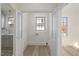Laundry room featuring hardwood floors and natural light from a window at 512 S 4Th St, Smithfield, NC 27577