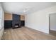 Cozy living room with a modern fireplace, built-in shelving, and sleek hardwood floors at 512 S 4Th St, Smithfield, NC 27577