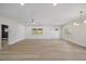 Large living room with hardwood floors, recessed lighting, decorative molding, and ceiling fan at 512 S 4Th St, Smithfield, NC 27577