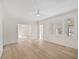 Bright living room with wood-look flooring and large windows for ample natural light at 512 S 4Th St, Smithfield, NC 27577