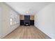 Bright living room featuring a modern fireplace, built-in shelving, and abundant natural light from large windows at 512 S 4Th St, Smithfield, NC 27577