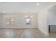 Open living room with hardwood floors, recessed lighting, and decorative molding at 512 S 4Th St, Smithfield, NC 27577