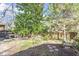 Relaxing backyard with outdoor seating, lush trees, and a tranquil atmosphere at 516 N Bloodworth St, Raleigh, NC 27604
