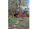Scenic backyard garden with lush greenery, stone bench, and a variety of plants at 516 N Bloodworth St, Raleigh, NC 27604