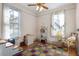 Bright bedroom with natural light, wooden floors, and a colorful rug at 516 N Bloodworth St, Raleigh, NC 27604