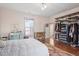 Light-filled bedroom features hardwood floors and an open closet providing ample storage at 516 N Bloodworth St, Raleigh, NC 27604
