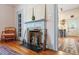 Charming dining area with antique fireplace, ornate woodwork, and artistic decor at 516 N Bloodworth St, Raleigh, NC 27604