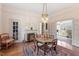 Elegant dining room with vintage rug, fireplace, and unique light fixture for a cozy atmosphere at 516 N Bloodworth St, Raleigh, NC 27604
