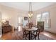 Charming dining room with hardwood floors, decorative rug, and large windows for natural light at 516 N Bloodworth St, Raleigh, NC 27604