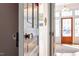 Inviting entryway with original glass door knob and a view into the home and the front porch at 516 N Bloodworth St, Raleigh, NC 27604