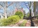 Charming two-story home with mature trees and a brick driveway at 516 N Bloodworth St, Raleigh, NC 27604