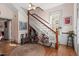 Bright foyer with hardwood floors, staircase, and interesting decor at 516 N Bloodworth St, Raleigh, NC 27604