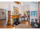 Stylish living room with hardwood floors, vintage fireplace, and eclectic decor accents at 516 N Bloodworth St, Raleigh, NC 27604