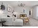 Cozy bonus room with a modern white sofa, decor, and black accents at 517 Providence Springs Ln, Fuquay Varina, NC 27526