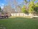 Expansive backyard with lush green grass, privacy fence, grilling area, and plenty of open space at 5321 Carnelian Dr, Raleigh, NC 27610