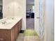Bathroom features double sink vanity and view into bedroom at 5321 Carnelian Dr, Raleigh, NC 27610