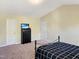 Bedroom features black furniture and carpet at 5321 Carnelian Dr, Raleigh, NC 27610