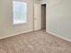 Carpeted bedroom with white walls and a window with blinds at 5321 Carnelian Dr, Raleigh, NC 27610