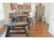 Cozy kitchen nook with a breakfast table, stainless steel appliances, and hardwood floors at 5321 Carnelian Dr, Raleigh, NC 27610