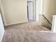 Carpeted hallway featuring access to multiple rooms at 5321 Carnelian Dr, Raleigh, NC 27610